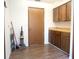 Spacious mud room area features wood-look floors, cabinetry, and ample counter space at 1334 Highland Park S Dr, Lake Wales, FL 33898