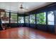 Spacious screened sun room with tile flooring and expansive views of the outdoors at 1334 Highland Park S Dr, Lake Wales, FL 33898