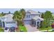 Aerial view of a beautiful two-story home showcasing its well-maintained landscaping and gray color scheme at 1433 Bunker Dr, Davenport, FL 33896