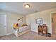 Bright bedroom featuring a twin bed with built-in storage, carpeted floors, and natural light at 1433 Bunker Dr, Davenport, FL 33896