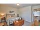 Cozy bedroom with an iron bed frame, wooden chest, and complementary wall decor at 1433 Bunker Dr, Davenport, FL 33896