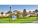 Oasis Clubhouse featuring lush landscaping, manicured lawns, and a welcoming entrance at 1433 Bunker Dr, Davenport, FL 33896