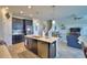 Bright open kitchen and Gathering room with stainless appliances, kitchen island, and lots of light at 1433 Bunker Dr, Davenport, FL 33896