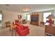 Open living room features plush seating, entertainment center, and plenty of natural light at 1433 Bunker Dr, Davenport, FL 33896