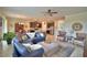 Open concept living room area provides plenty of room to relax with easy access to the dining and kitchen areas at 1433 Bunker Dr, Davenport, FL 33896
