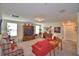 Spacious upstairs living room with comfortable seating, decor and natural light from windows at 1433 Bunker Dr, Davenport, FL 33896