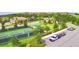 Overhead shot of pickleball courts and putting green near a parking lot in the community at 1433 Bunker Dr, Davenport, FL 33896