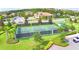 Aerial image of well-maintained pickleball courts with lush landscaping in a vibrant community setting at 1433 Bunker Dr, Davenport, FL 33896