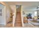 Bright, open stairway leads to the upper level, with tiled floor entry and open living space at 1433 Bunker Dr, Davenport, FL 33896
