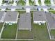 Aerial view of similar homes with tidy backyards in a suburban neighborhood at 1719 Durden Dr, Winter Haven, FL 33880