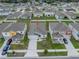 An aerial view of a home in a manicured neighborhood with tidy landscaping at 1719 Durden Dr, Winter Haven, FL 33880
