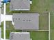 An aerial shot of a home with grey roof and tidy fenced in backyard at 1719 Durden Dr, Winter Haven, FL 33880