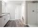 Bright bathroom with double vanity and a walk-in shower at 1719 Durden Dr, Winter Haven, FL 33880