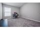 Bedroom with ample natural light, carpet, desk and chair at 1719 Durden Dr, Winter Haven, FL 33880