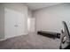 Bedroom with neutral carpet, a closet, and an open door at 1719 Durden Dr, Winter Haven, FL 33880