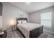 Cozy bedroom features a queen-sized bed, soft carpet, and a serene ambiance for relaxation and comfort at 1719 Durden Dr, Winter Haven, FL 33880