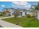 Inviting single-story home with a two-car garage, manicured lawn, and lush landscaping, ideal for comfortable living at 1719 Durden Dr, Winter Haven, FL 33880