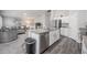 Open-concept kitchen with granite island flows into the living area, perfect for entertaining at 1719 Durden Dr, Winter Haven, FL 33880