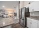 Kitchen featuring stainless steel refrigerator with granite counter tops at 1719 Durden Dr, Winter Haven, FL 33880