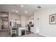 Bright kitchen features stainless appliances, granite counters, and white cabinets at 1719 Durden Dr, Winter Haven, FL 33880