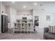 Modern kitchen with stainless steel appliances and bar seating at 1719 Durden Dr, Winter Haven, FL 33880