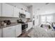 Well-equipped kitchen with stainless steel appliances and ample counter space at 1719 Durden Dr, Winter Haven, FL 33880