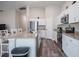 Bright kitchen features granite countertops, stainless steel appliances, and white cabinetry at 1719 Durden Dr, Winter Haven, FL 33880