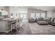 Open-concept living space with modern decor and breakfast bar seating at 1719 Durden Dr, Winter Haven, FL 33880