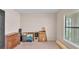 Bedroom with beige carpet and natural light from the window with blinds at 1765 Kingsmill Dr, Bartow, FL 33830