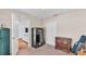 Bedroom featuring a safe, wooden cabinet, and access to another room with hardwood floors at 1765 Kingsmill Dr, Bartow, FL 33830