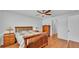 Comfortable bedroom featuring wood floors, a ceiling fan, and a neutral color scheme at 1765 Kingsmill Dr, Bartow, FL 33830