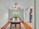 Spacious dining area featuring a long table and a view of the outdoors at 1765 Kingsmill Dr, Bartow, FL 33830