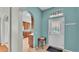 Charming foyer with decorative glass door and a view into the kitchen at 1765 Kingsmill Dr, Bartow, FL 33830