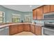 Well-appointed kitchen with stainless steel appliances and corner sink at 1765 Kingsmill Dr, Bartow, FL 33830