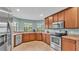 Contemporary kitchen with stainless appliances and ample counter space for cooking at 1765 Kingsmill Dr, Bartow, FL 33830
