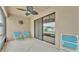 Covered patio includes a ceiling fan and two chairs overlooking the pool at 1765 Kingsmill Dr, Bartow, FL 33830
