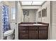 Full bathroom featuring a vanity with dark wood cabinets and a shower/tub combo at 1810 Roanoke Ave, Lakeland, FL 33803