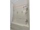Bathroom featuring a shower and tub with chrome fixtures and safety bars at 1810 Roanoke Ave, Lakeland, FL 33803