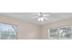 Bedroom with two windows providing natural light and a ceiling fan at 1810 Roanoke Ave, Lakeland, FL 33803