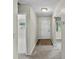Inviting entryway with neutral paint, carpet flooring, and an interior door at 1810 Roanoke Ave, Lakeland, FL 33803