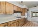 Kitchen featuring wood cabinetry, wood-look flooring, and an oven at 1810 Roanoke Ave, Lakeland, FL 33803