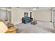 Spacious living room with plush carpet and a ceiling fan at 1810 Roanoke Ave, Lakeland, FL 33803