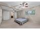 Spacious main bedroom with ceiling fans, neutral carpeting, and ample closet space at 1810 Roanoke Ave, Lakeland, FL 33803