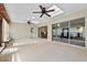 Bright sunroom featuring tile flooring, skylights, and sliding glass doors at 1810 Roanoke Ave, Lakeland, FL 33803