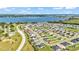 An aerial shot showcasing the neighborhood, its well-planned layout, and proximity to the lake at 204 Walkers Point Dr, Auburndale, FL 33823