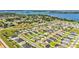 Neighborhood aerial view showcasing lake and manicured lawns at 204 Walkers Point Dr, Auburndale, FL 33823