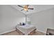 Well lit bedroom with a large window and neutral decor at 204 Walkers Point Dr, Auburndale, FL 33823