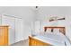 Neutral bedroom boasts vaulted ceilings and a double door closet at 204 Walkers Point Dr, Auburndale, FL 33823