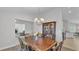 Traditional dining room with wood table, chairs, china cabinet and chandelier lighting at 204 Walkers Point Dr, Auburndale, FL 33823