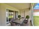 Outdoor dining space with an elegant table and chairs in the screened lanai at 204 Walkers Point Dr, Auburndale, FL 33823